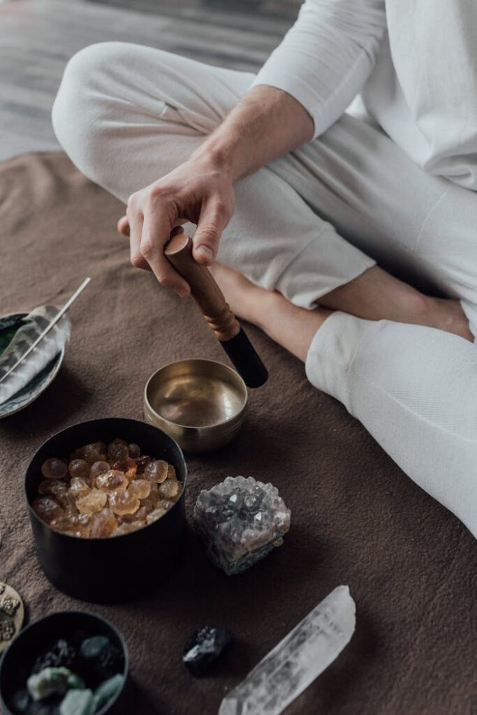pexels-photo-6998595 A Person Sitting on the Floor Using a Tibetan Singing Bowl